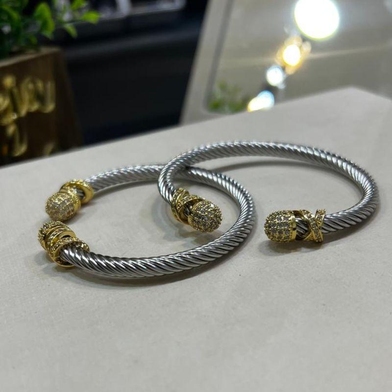 Bracelete cabo de aço com ponta dourada cravejada